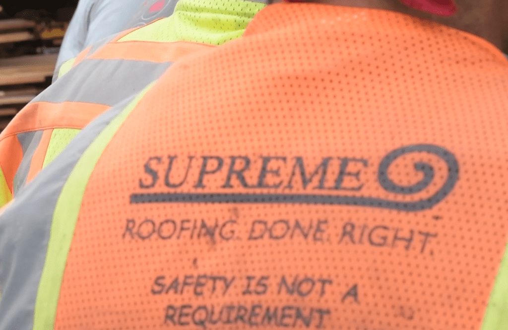 Safety vest with supreme logo.