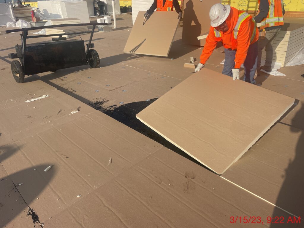 Man installing commercial roof.