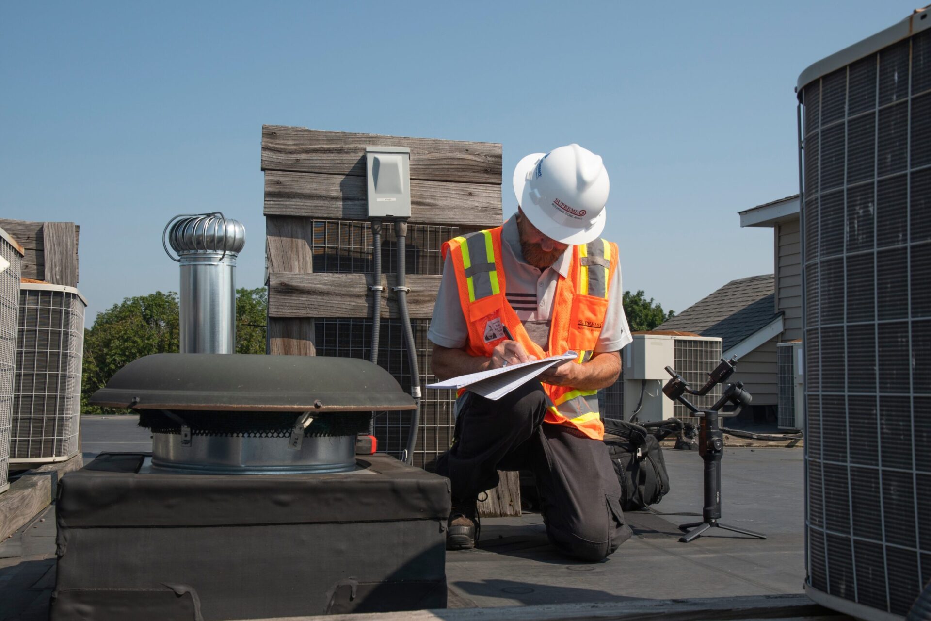 Man doing commercial roof inspection.